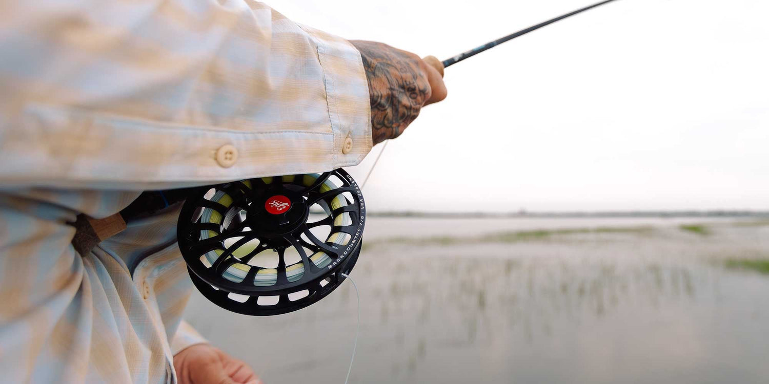 790Ti Taniam fly rod held by man on flats