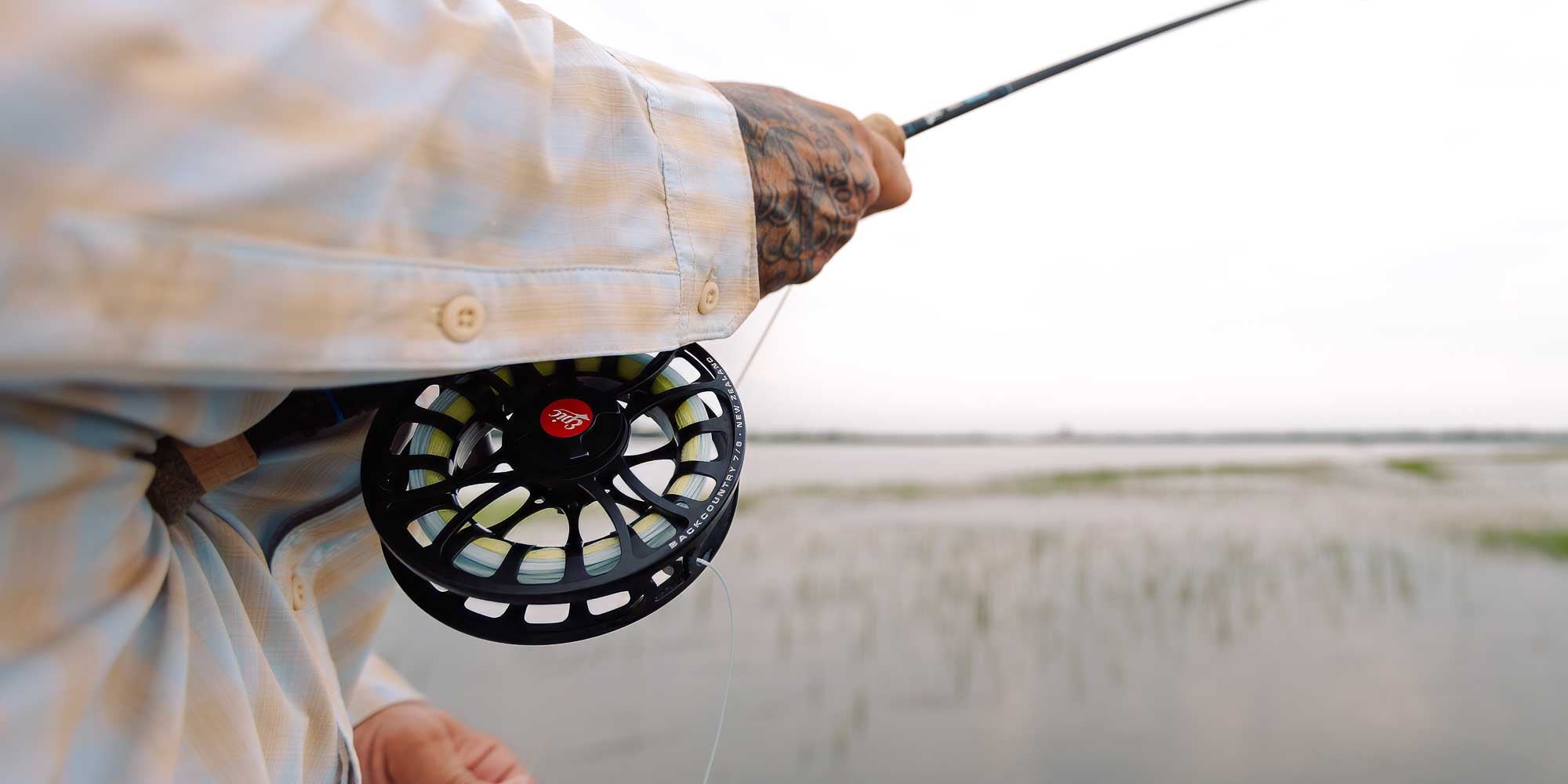 790Ti Taniam fly rod held by man on flats