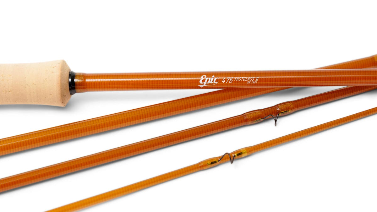 Close-up of a amber colored fly-fishing rod shown in multiple sections.