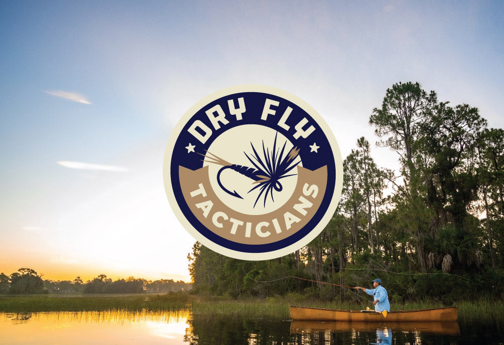 Logo of 'Dry Fly Tacticians' over a scenic lake with a person fishing at sunset.
