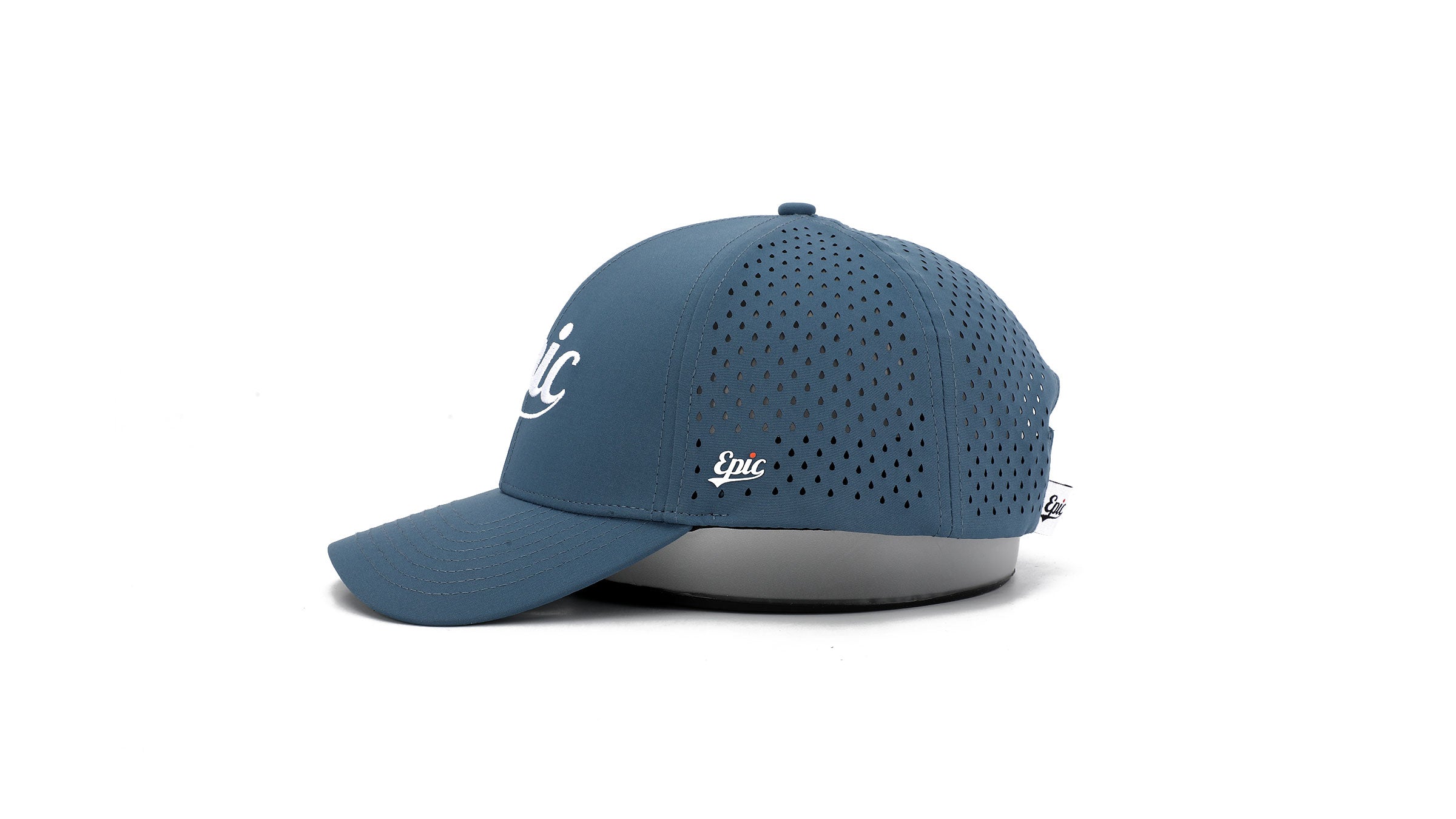 Side view of blue trucker cap with white logo on a white background