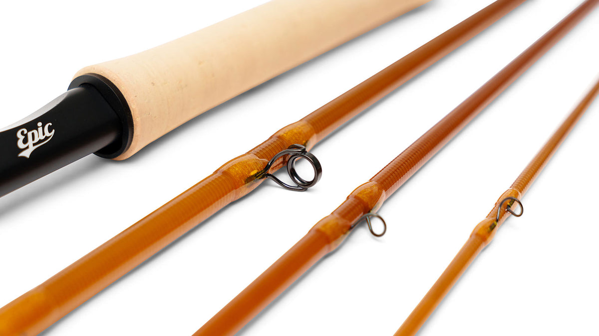 Close-up of amber colored fly-fishing rod set with a light natural cork handle, black reel seat and white 'Epic' logo.