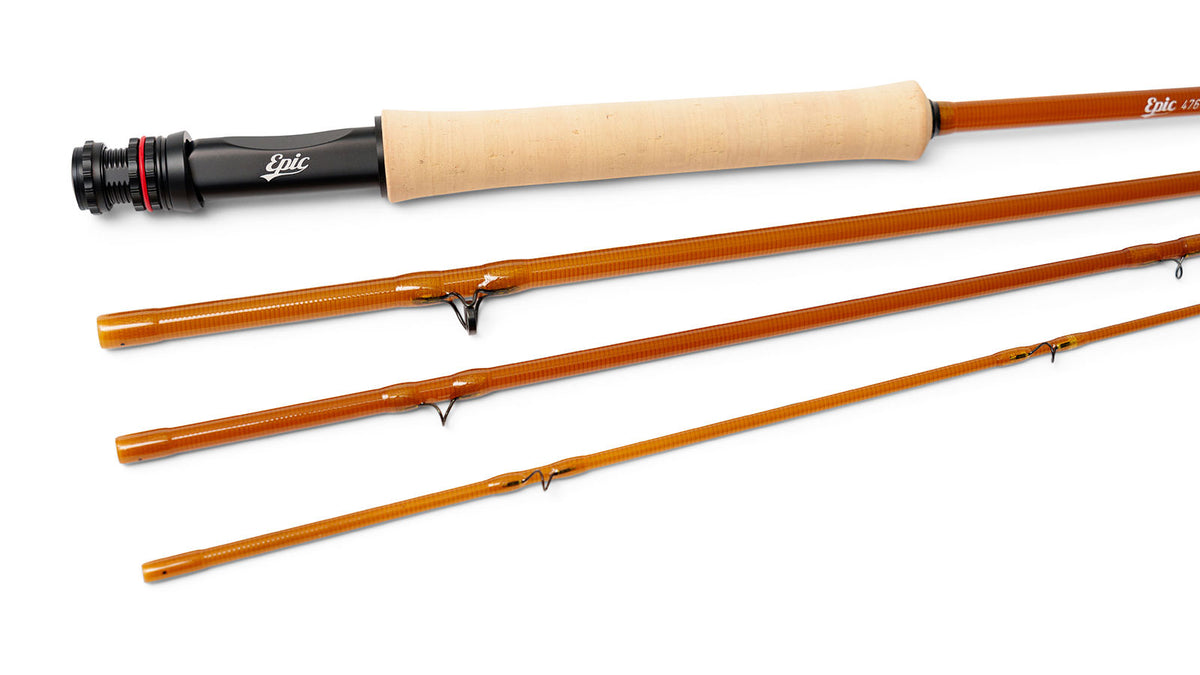Amber colored fly fishing rod displayed on a clean white background. The rod features a black reel seat and natural cork grip. 